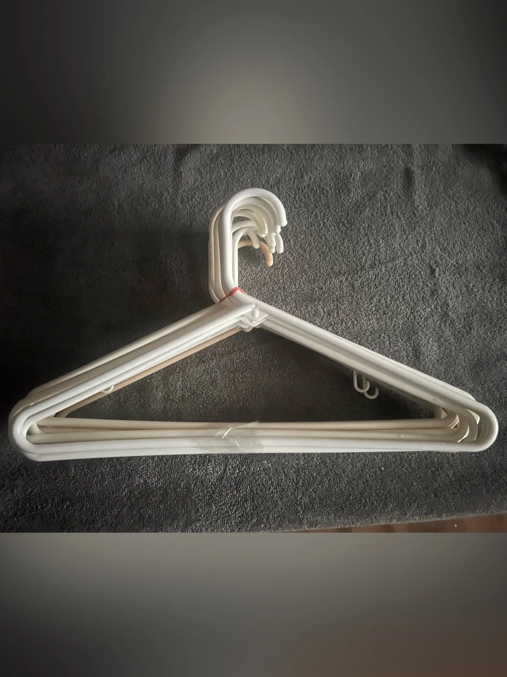 One Dozen White Plastic Clothing Hangers